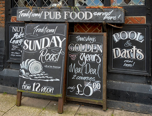 Photo: Chalk boards outside a typical British pub